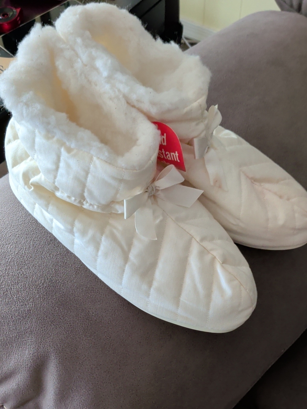 Women's Cream Quilted Fleece-Lined Bootie Slippers with Bow Accent